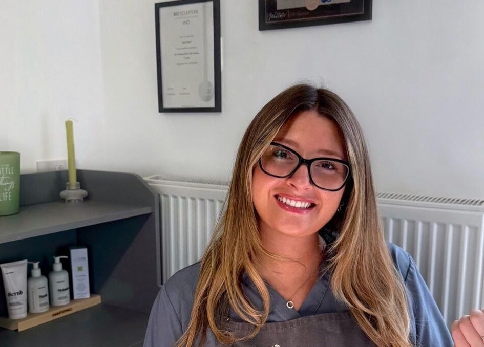 Smiling staff at Serenity Studio, Great Canfield, England. Beauty and wellness ambiance displayed.