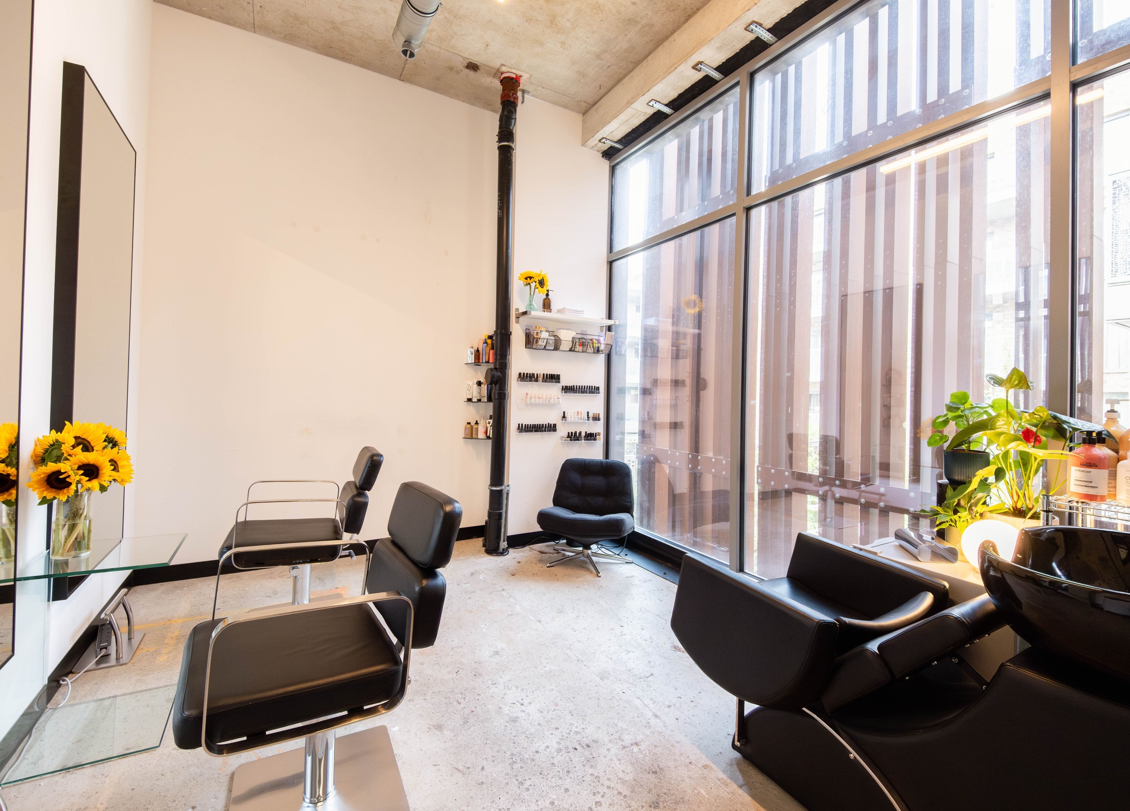Modern salon setup at SPACE5, London, GB with sleek chairs and bright decor.