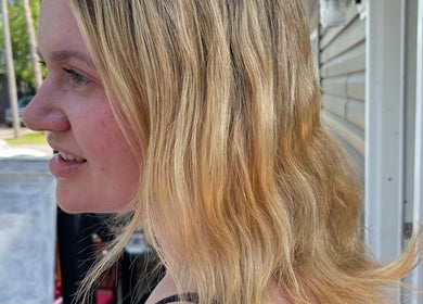 Side view of blonde hair styled in soft waves at Orillia & Area Luxury Extension Beauty Bar, Orillia, Ontario, CA.
