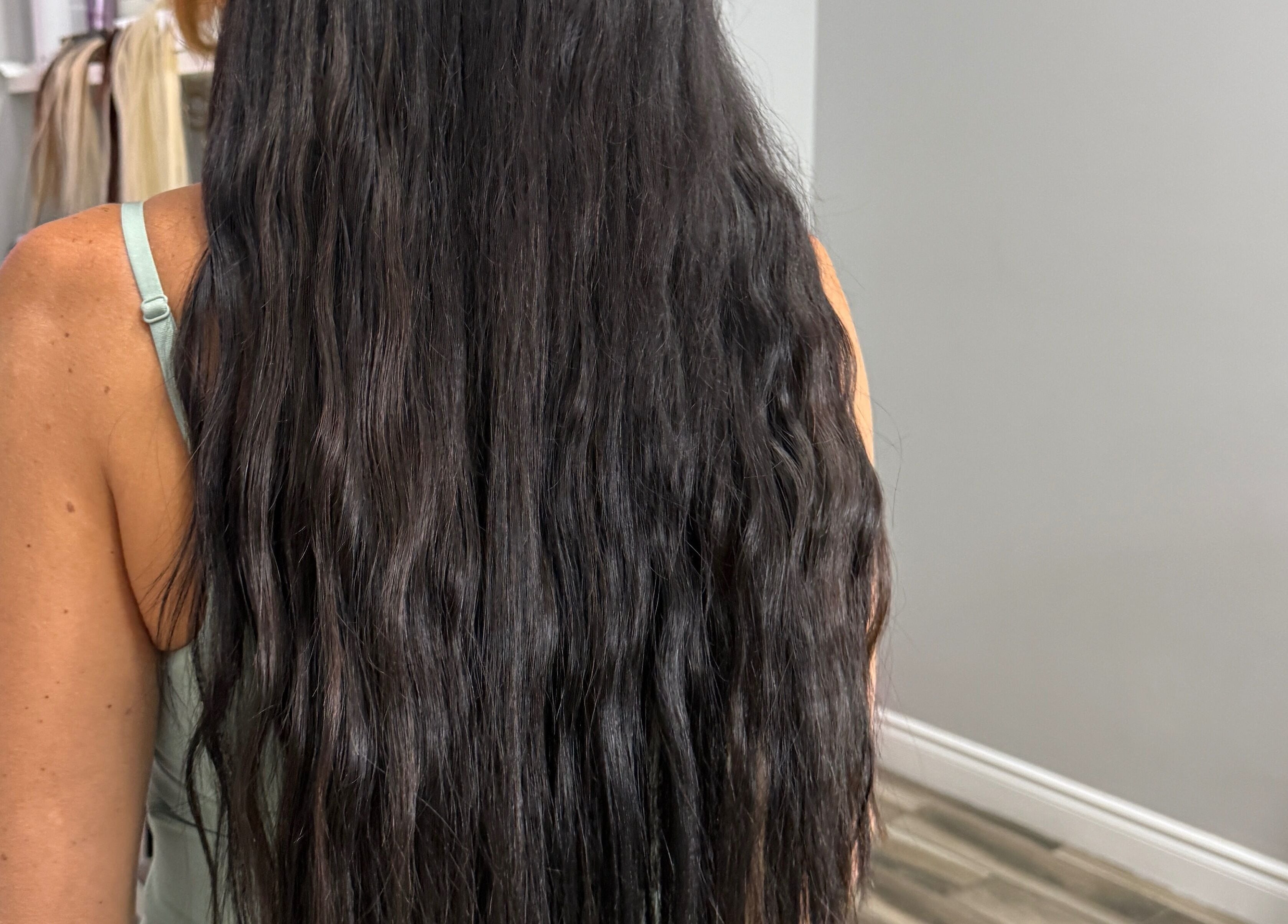 Long, wavy hair with extensions at Orillia & Area Luxury Extension Beauty Bar, Orillia, Ontario, CA.