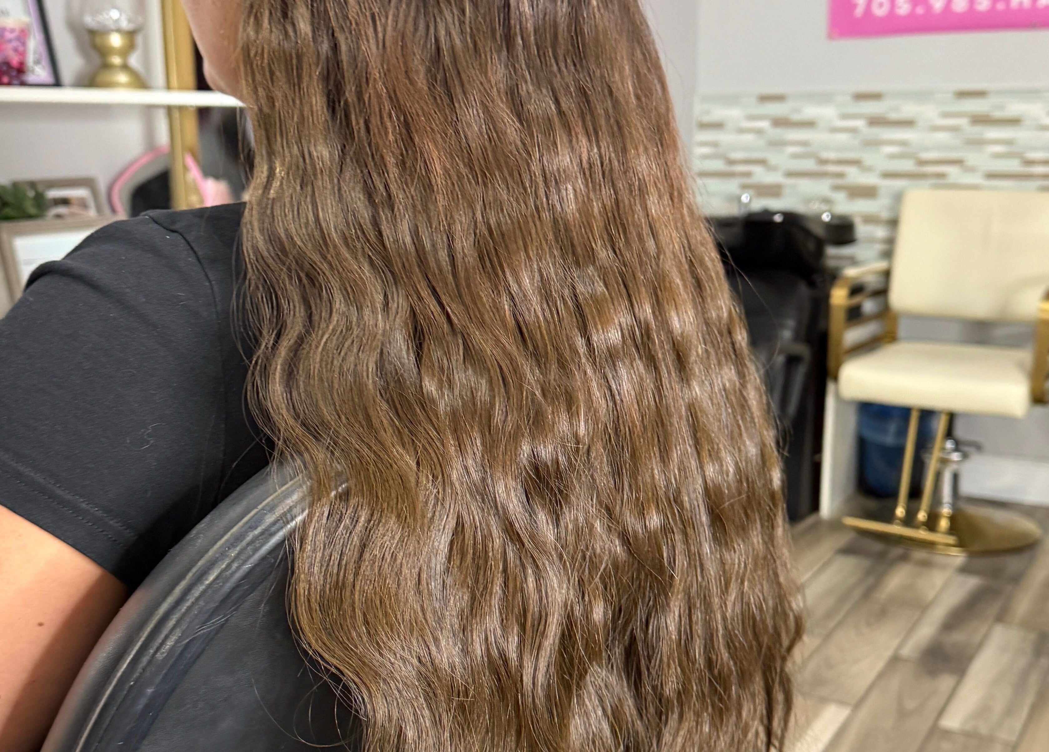 Long wavy hair styled at Orillia & Area Luxury Extension Beauty Bar, Orillia, Ontario, CA.