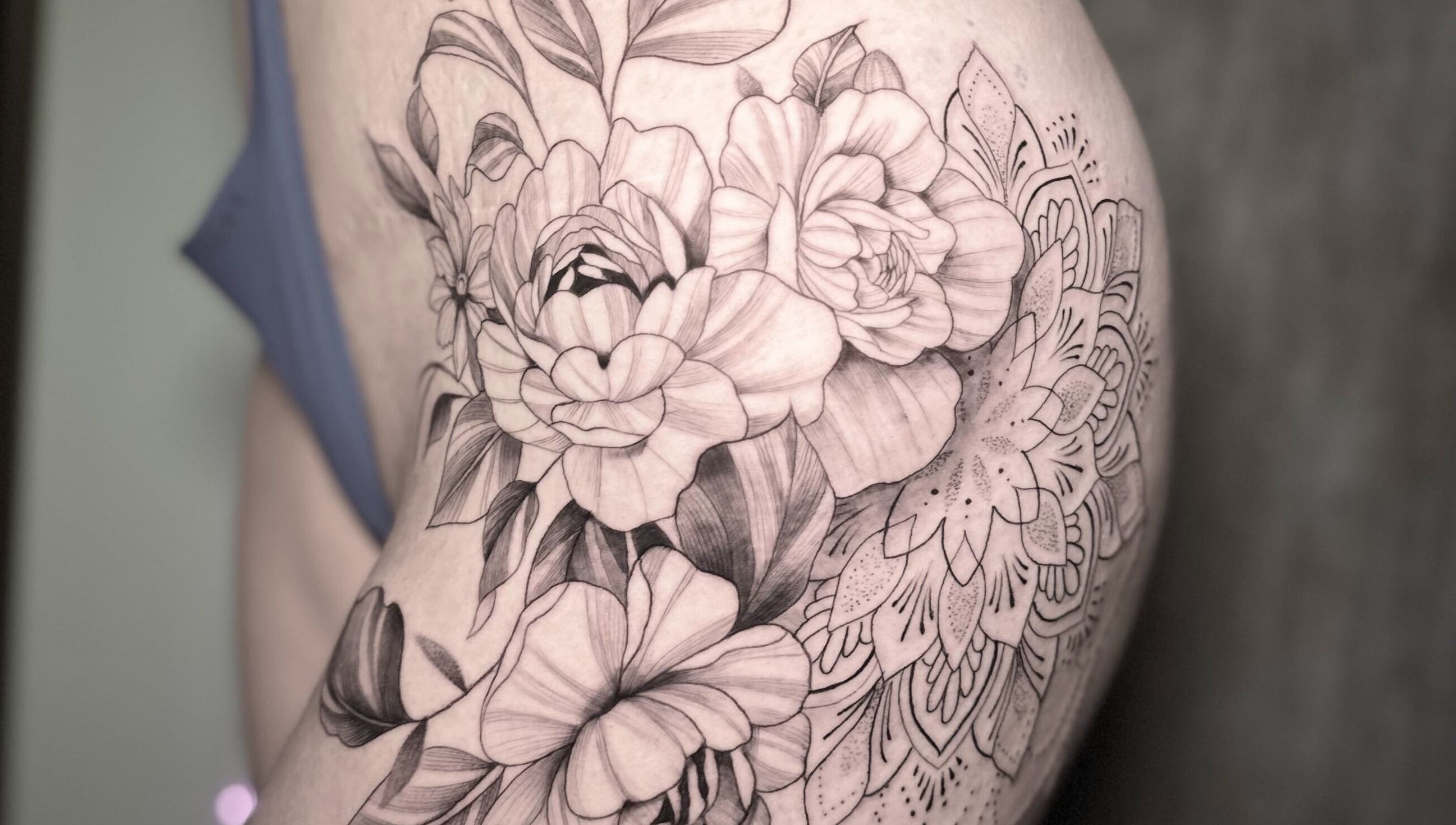 Intricate floral tattoo design at Nataly at Meadow & Charm - Council Bluffs, Iowa, US.