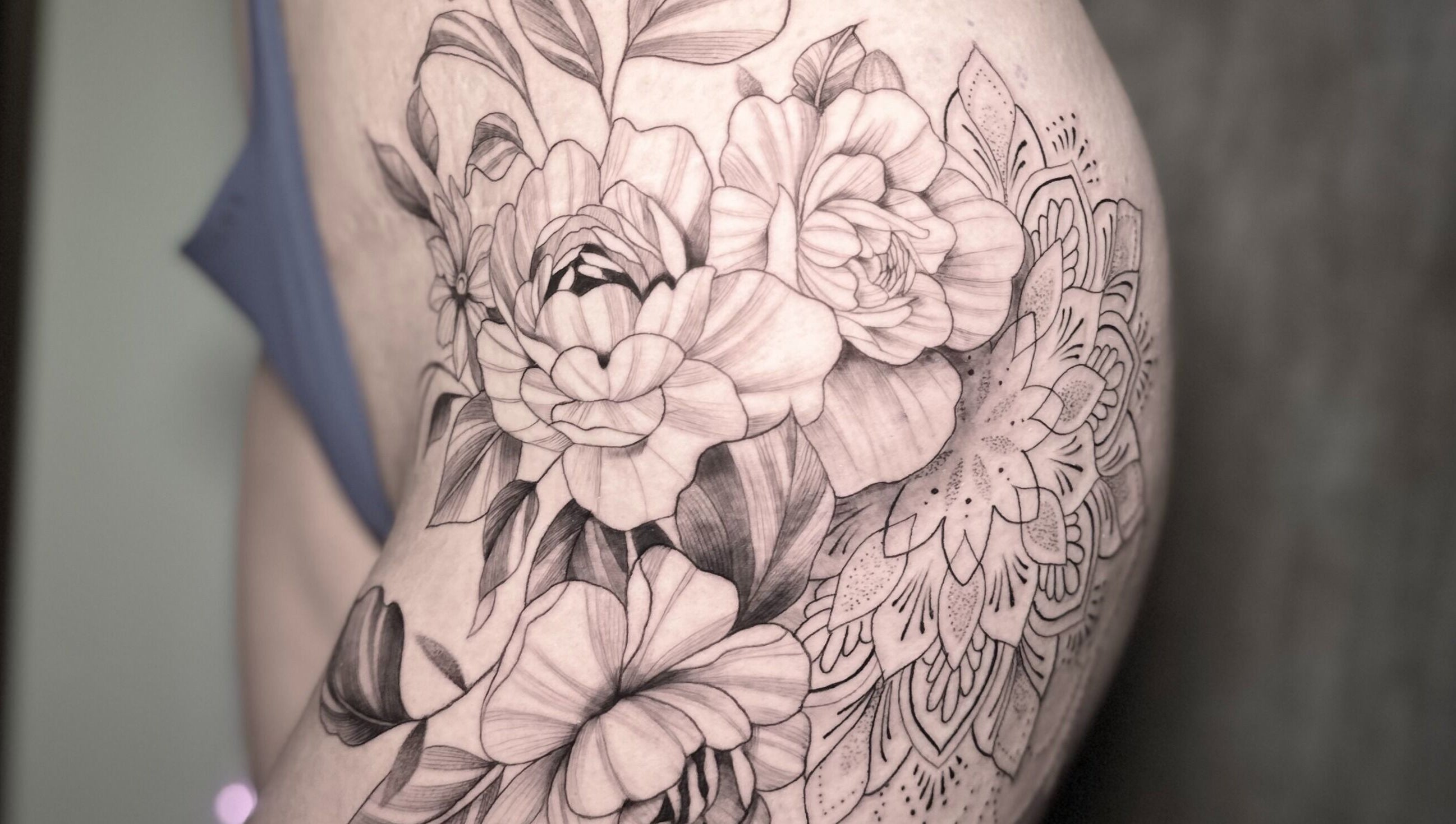Intricate floral tattoo design at Nataly at Meadow & Charm - Council Bluffs, Iowa, US.