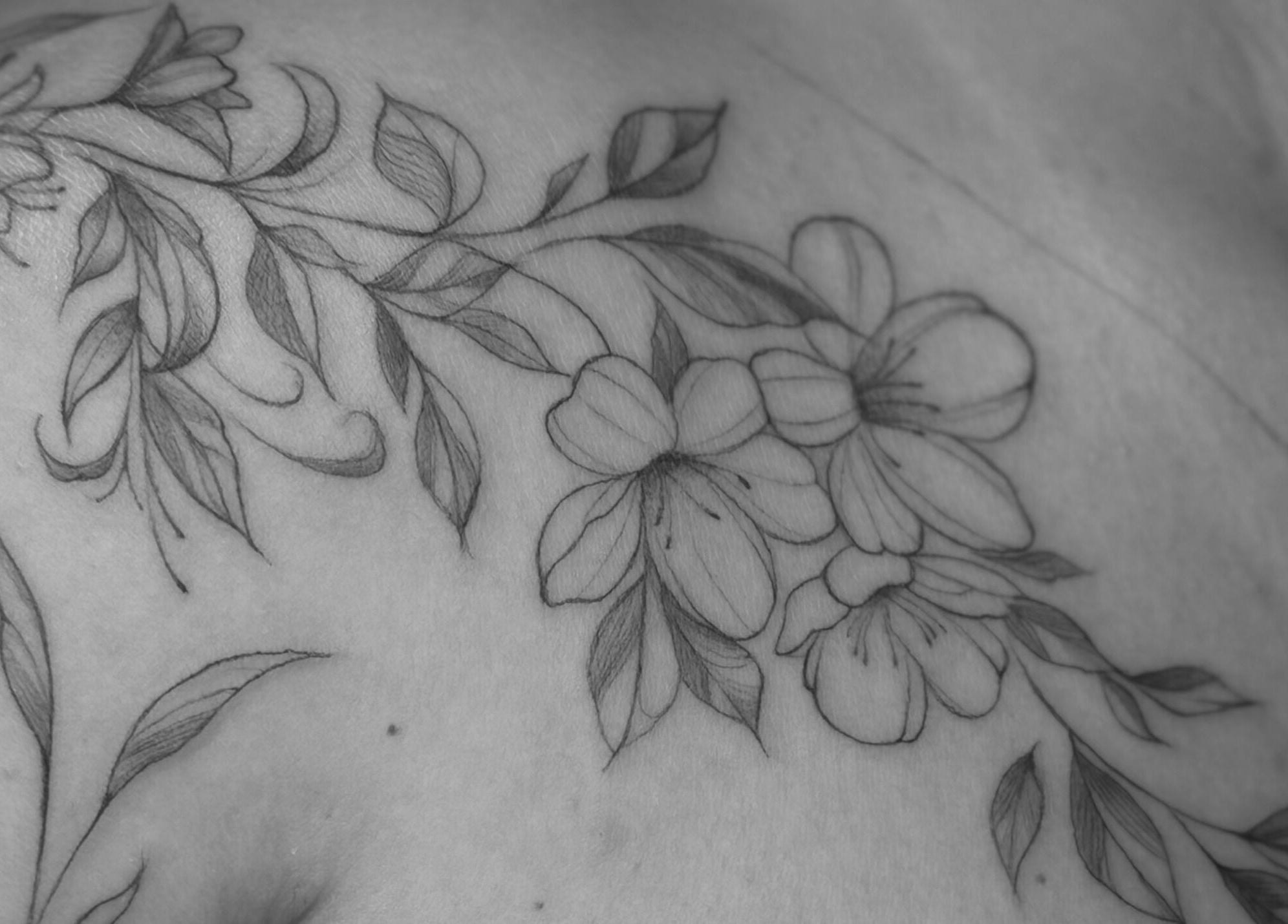 Intricate floral tattoo at Nataly at Meadow & Charm - Council Bluffs, Council Bluffs, Iowa, US.