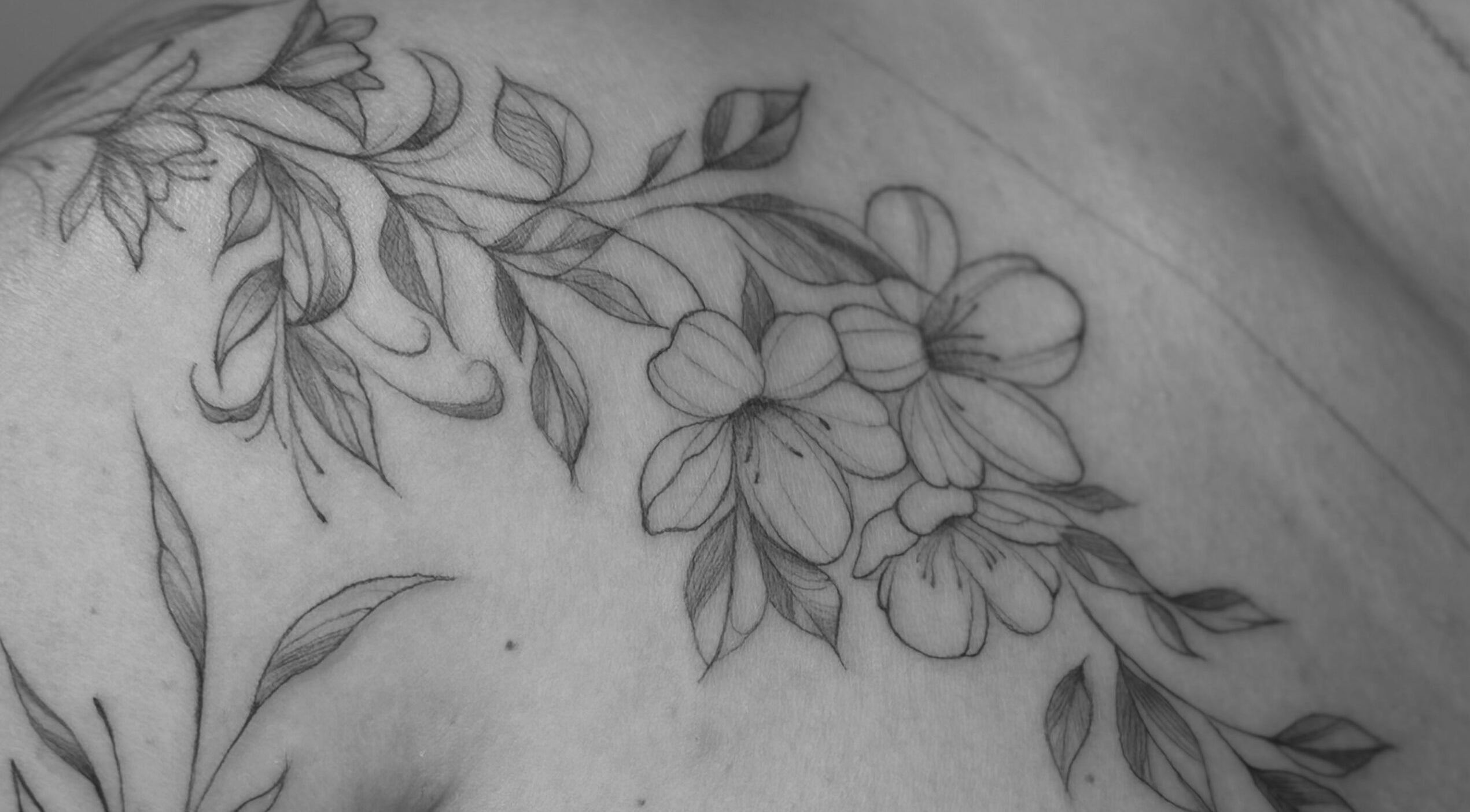 Intricate floral tattoo at Nataly at Meadow & Charm - Council Bluffs, Council Bluffs, Iowa, US.