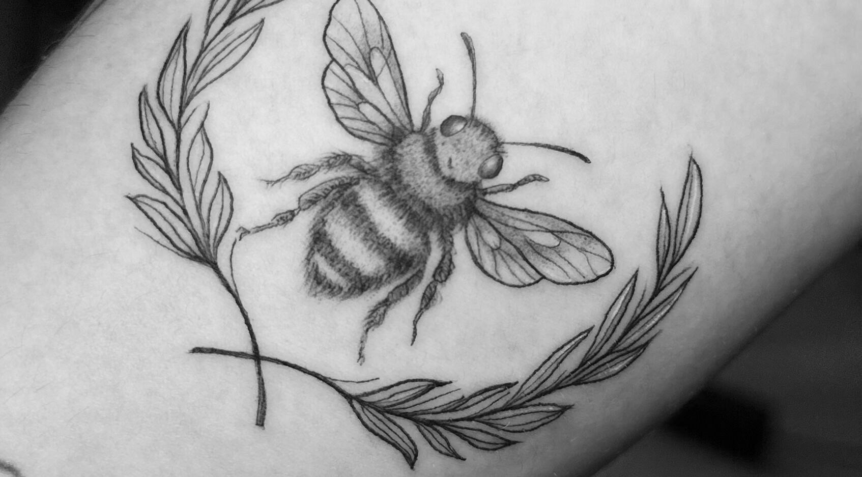 Detailed bee tattoo at Nataly at Meadow & Charm - Council Bluffs, Council Bluffs, Iowa, US.