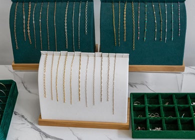 Jewelry display with bracelets and chains at Meadow & Charm - NEW LOCATION COUNCIL BLUFFS, Council Bluffs, Iowa, US.