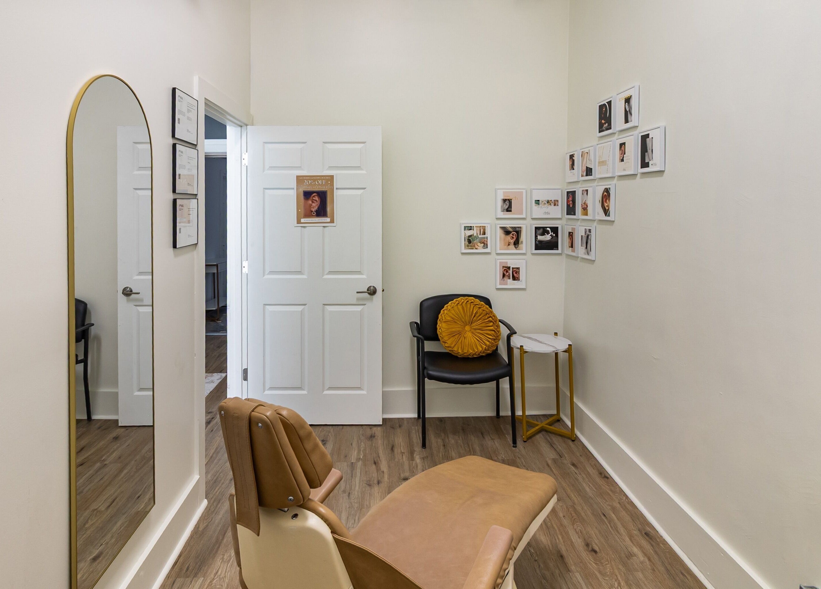 Relaxing therapy room at Meadow & Charm - Council Bluffs, Iowa, US with a stylish chair and wall décor.