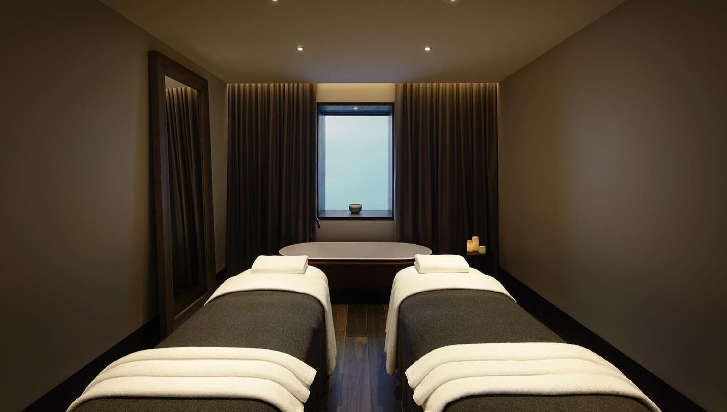 Luxurious treatment room at Hale Spa in Barton, Australian Capital Territory, AU with massage tables and candles.