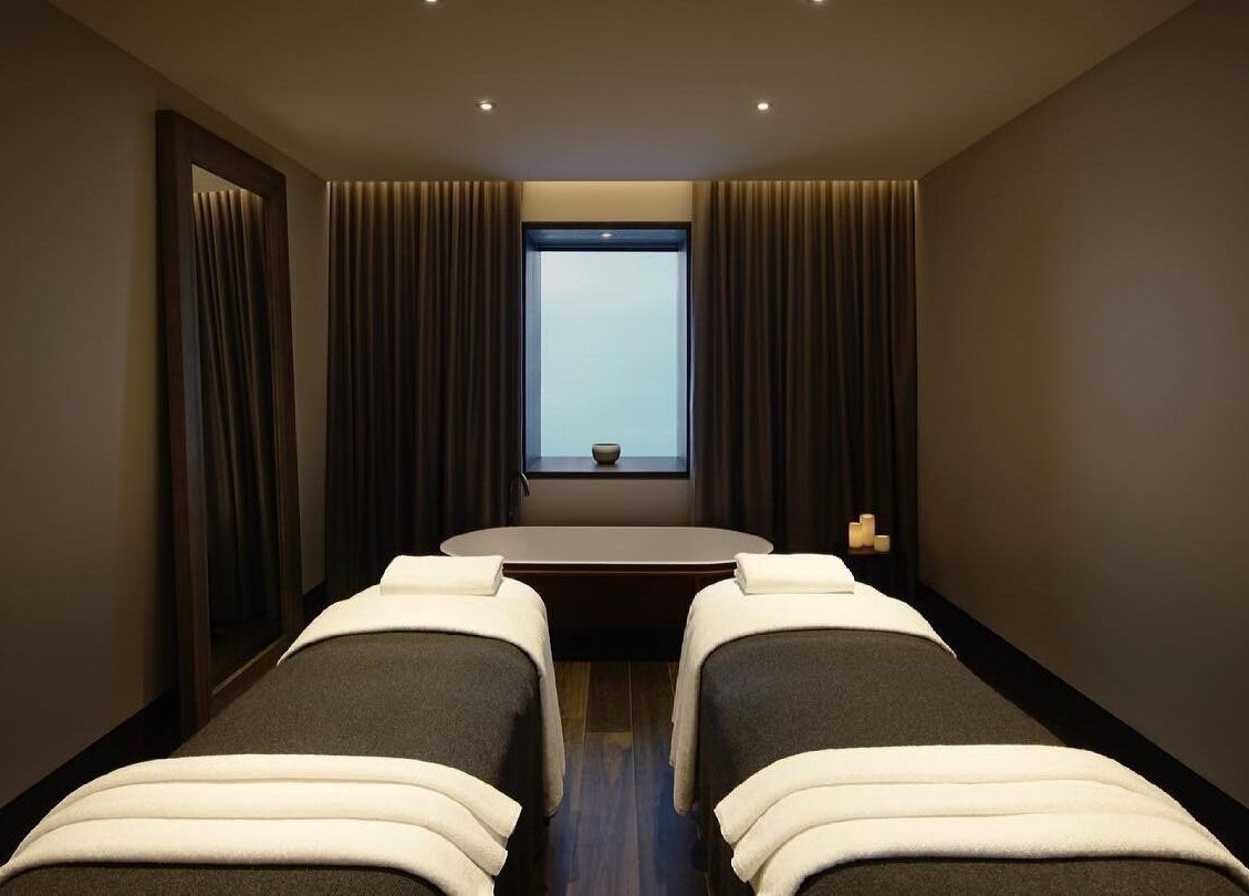 Luxurious treatment room at Hale Spa in Barton, Australian Capital Territory, AU with massage tables and candles.