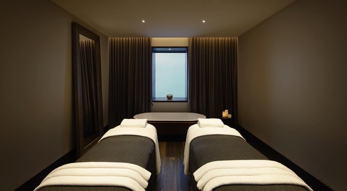 Luxurious treatment room at Hale Spa in Barton, Australian Capital Territory, AU with massage tables and candles.
