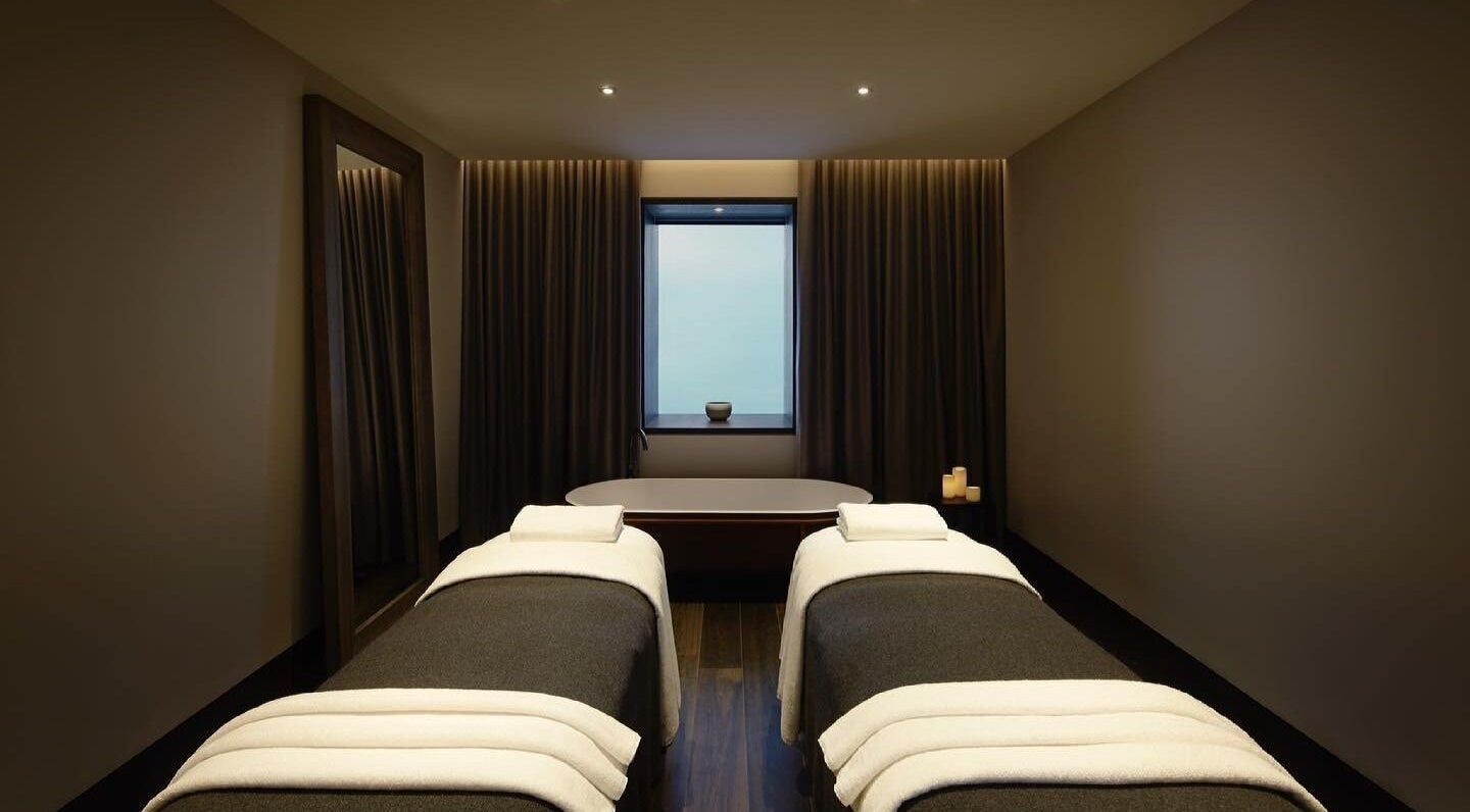 Luxurious treatment room at Hale Spa in Barton, Australian Capital Territory, AU with massage tables and candles.