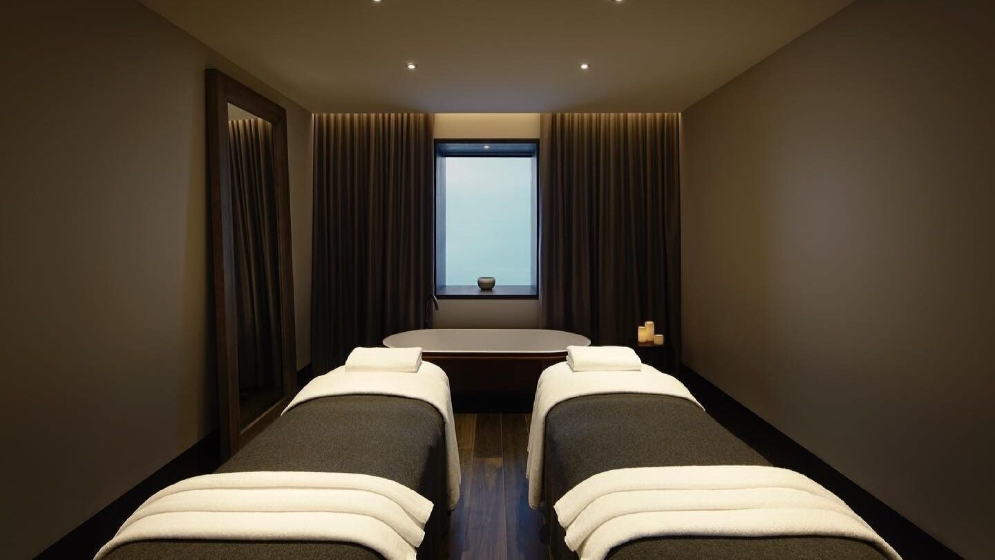Luxurious treatment room at Hale Spa in Barton, Australian Capital Territory, AU with massage tables and candles.