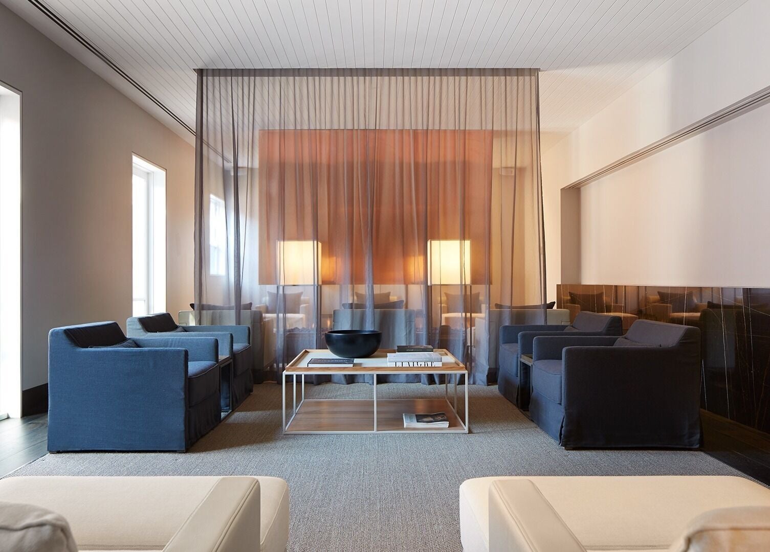 Elegant lounge area at Hale Spa, Barton, Australian Capital Territory, AU with chic seating and sheer curtains.