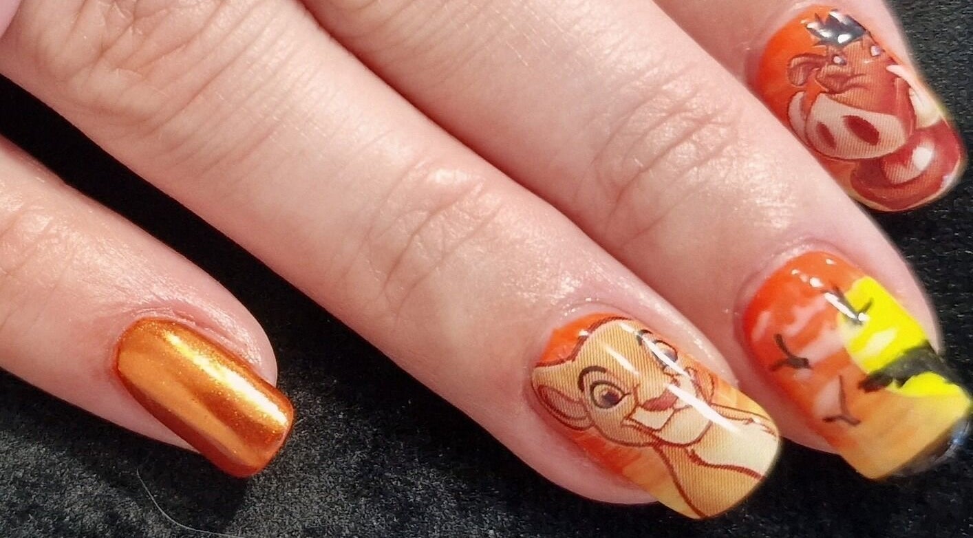 Stylish lion-themed nail art at Sarah Jane's Nails & Lashes, Southend-on-sea, England, GB.