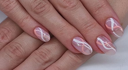Intricate nail art with pink and white swirls at Sarah Jane's Nails & Lashes, Southend-on-sea, England, GB.