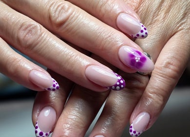 Stylish purple nail art at Sarah Jane's Nails & Lashes, Southend-on-sea, England, GB.