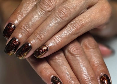 Sparkling black and gold nails at Sarah Jane's Nails & Lashes, Southend-on-sea, England, GB.