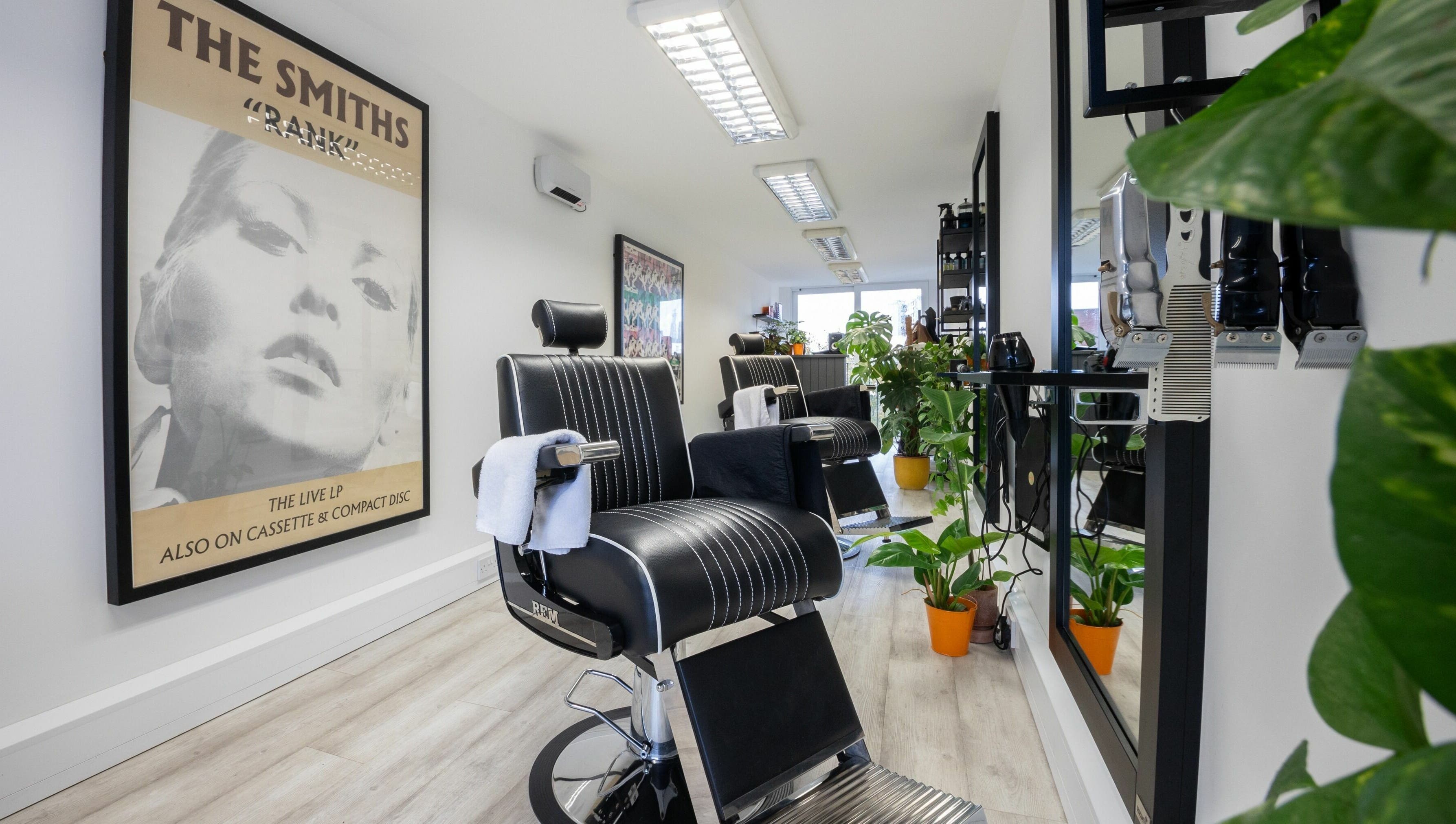 Stylish salon interior at Sawyer in London, England, GB with modern chairs and vibrant decor.