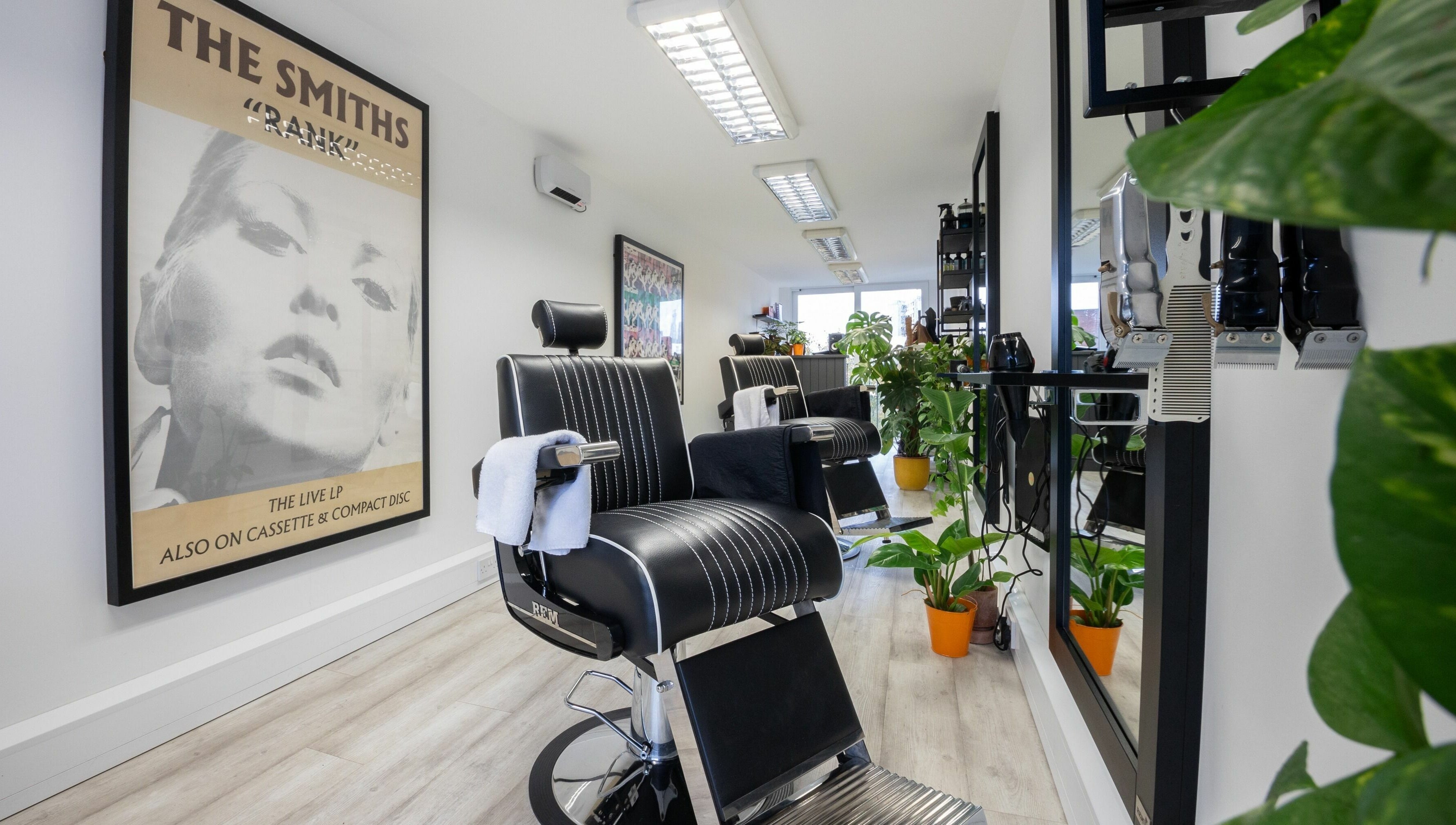 Stylish salon interior at Sawyer in London, England, GB with modern chairs and vibrant decor.