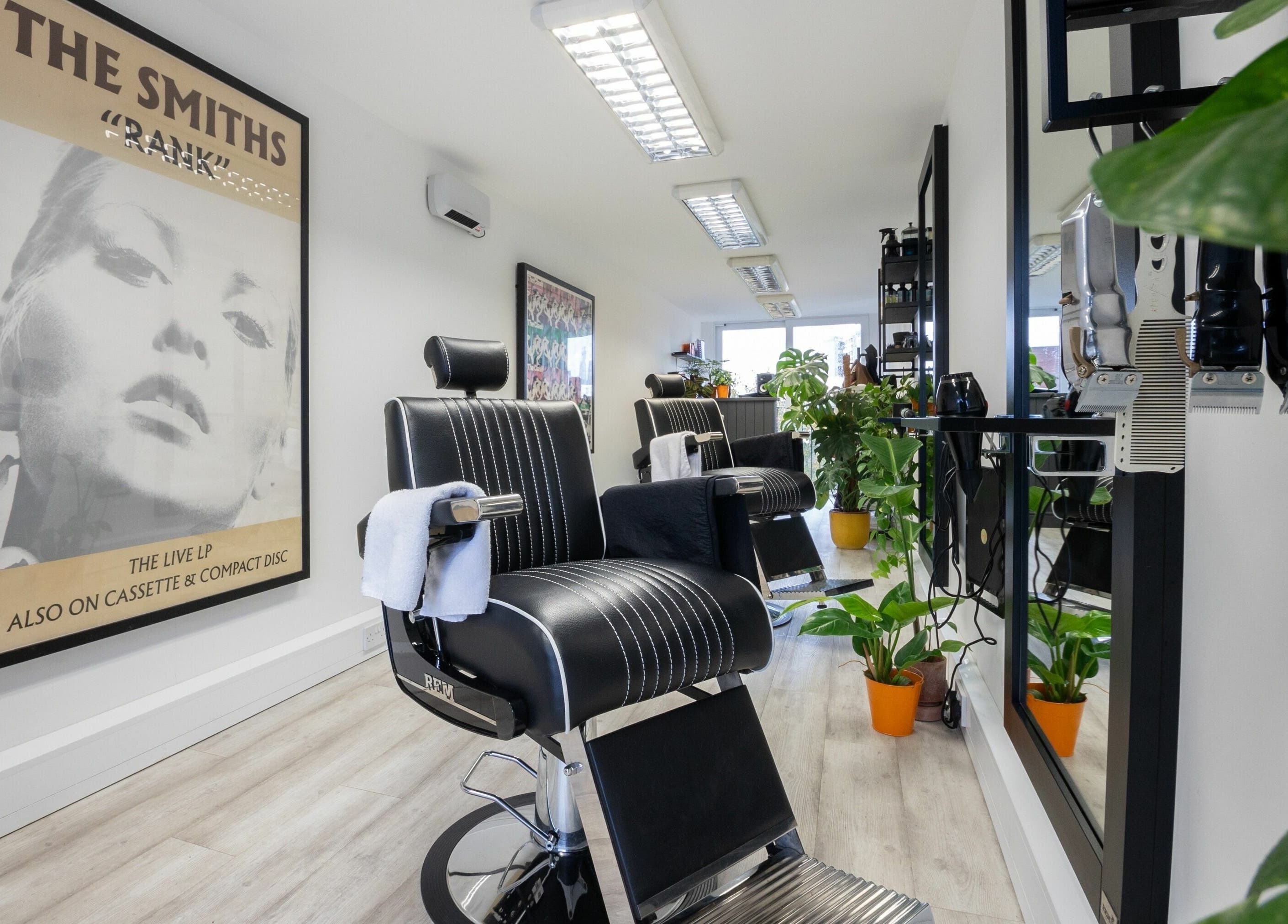 Stylish salon interior at Sawyer in London, England, GB with modern chairs and vibrant decor.