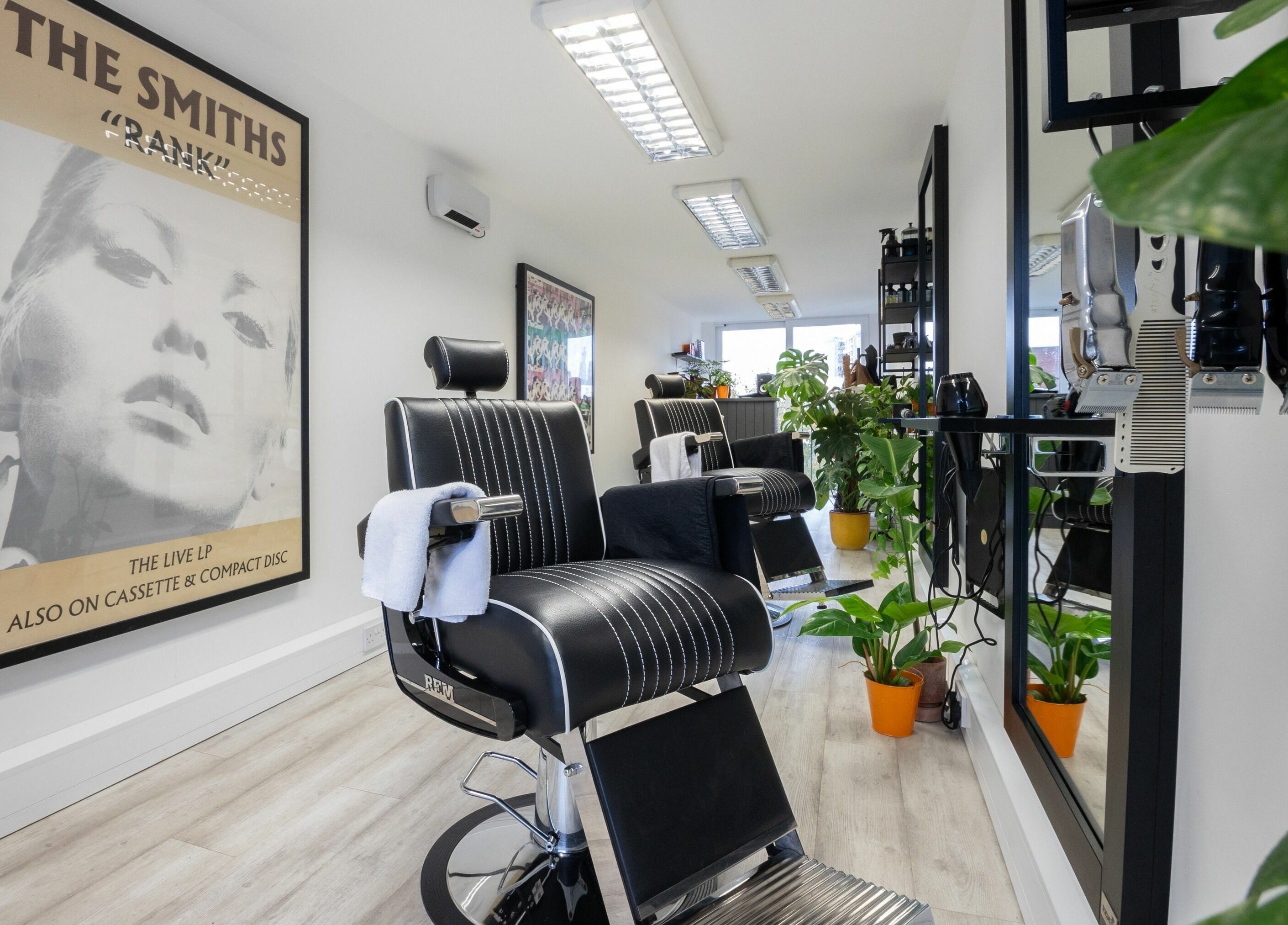 Stylish salon interior at Sawyer in London, England, GB with modern chairs and vibrant decor.