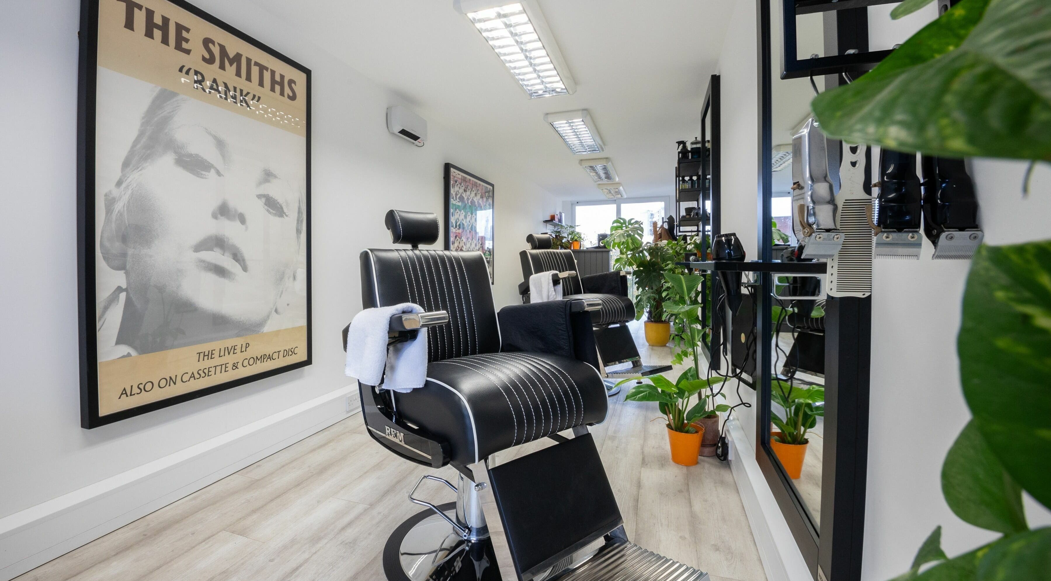 Stylish salon interior at Sawyer in London, England, GB with modern chairs and vibrant decor.