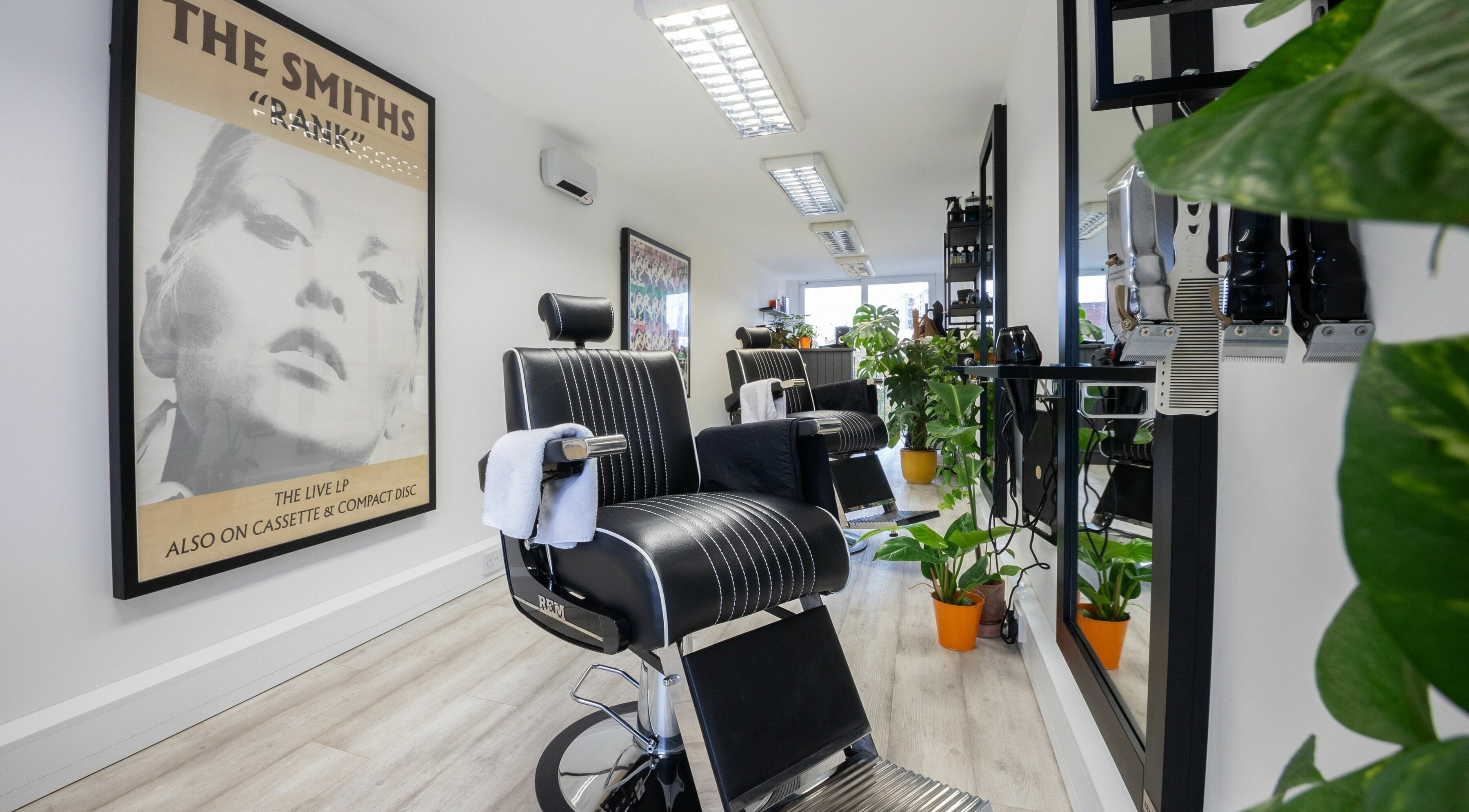 Stylish salon interior at Sawyer in London, England, GB with modern chairs and vibrant decor.