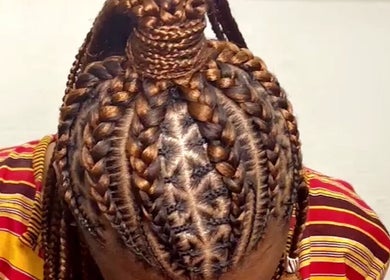 Intricate braid style at Baddie Hair & Beauty in Kampala, Central Region, UG, showcasing artistic hair design.