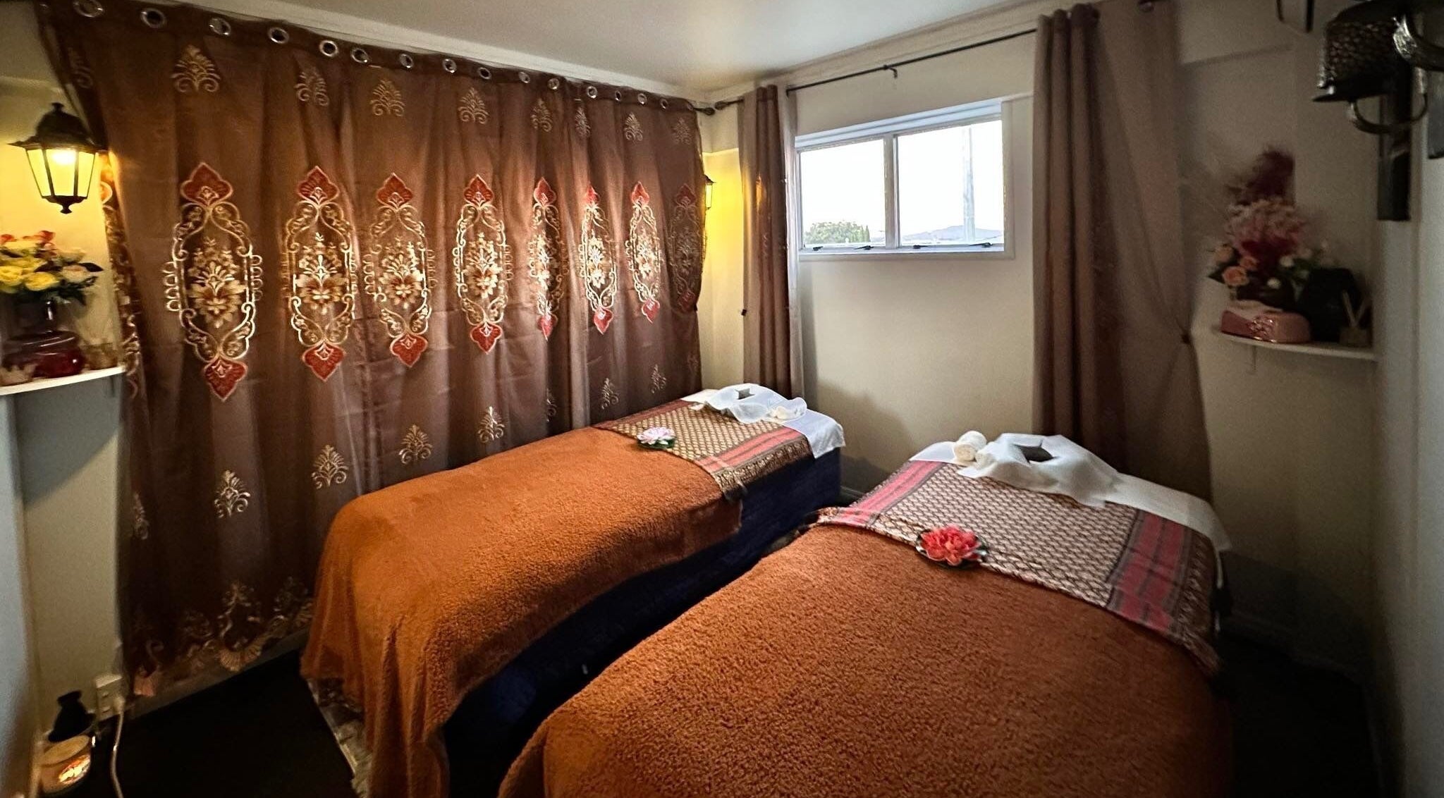 Relaxing twin massage beds at Tranquil Thai Massage - Birkenhead, Auckland, Auckland, NZ with elegant decor.