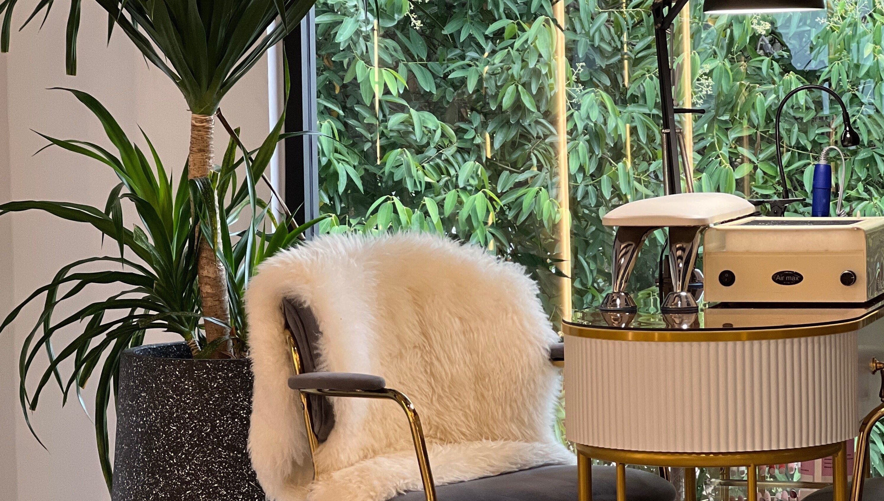 Cozy spa chair with plush fur at Browserie, Petaling Jaya, Selangor, MY, surrounded by lush greenery.