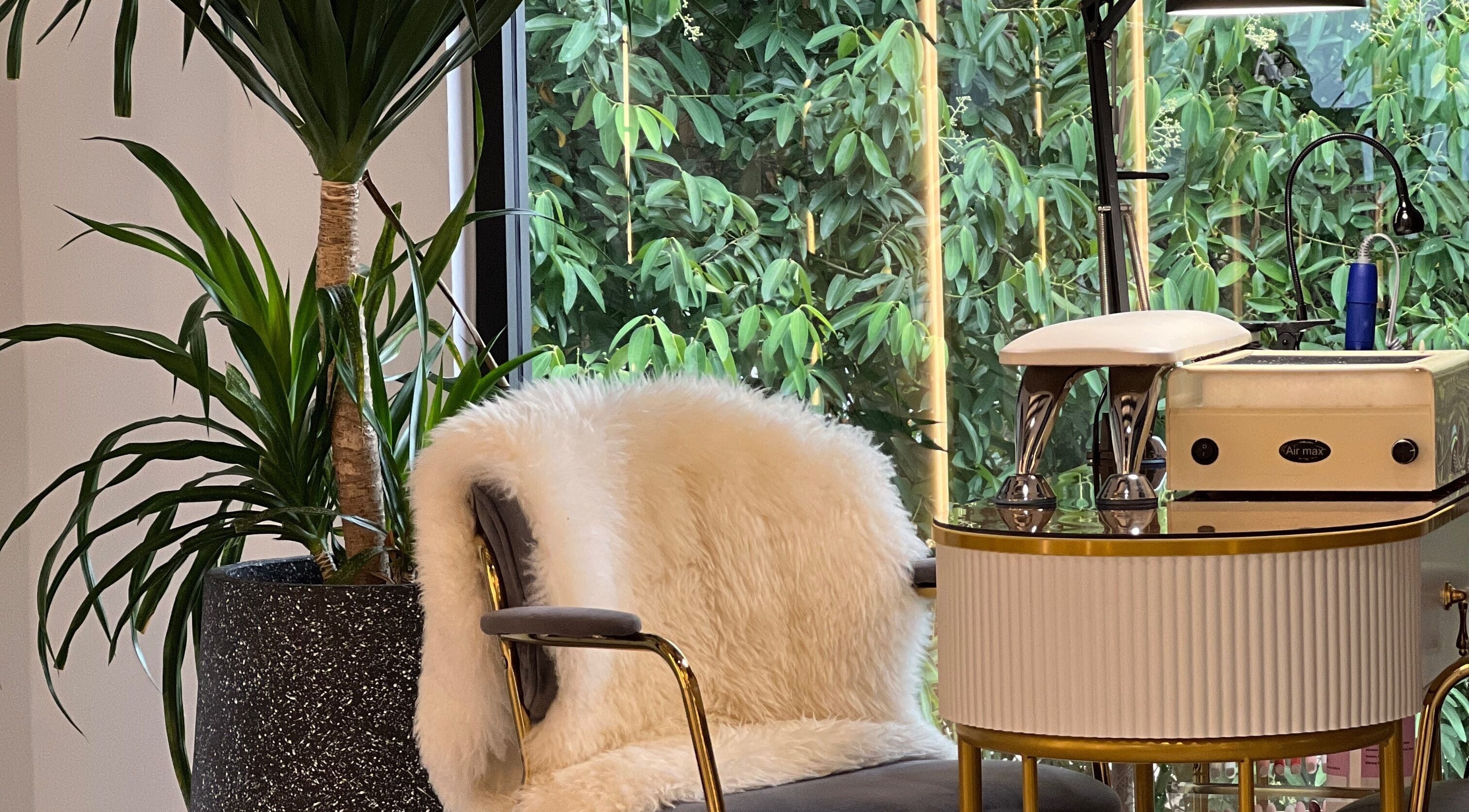 Cozy spa chair with plush fur at Browserie, Petaling Jaya, Selangor, MY, surrounded by lush greenery.