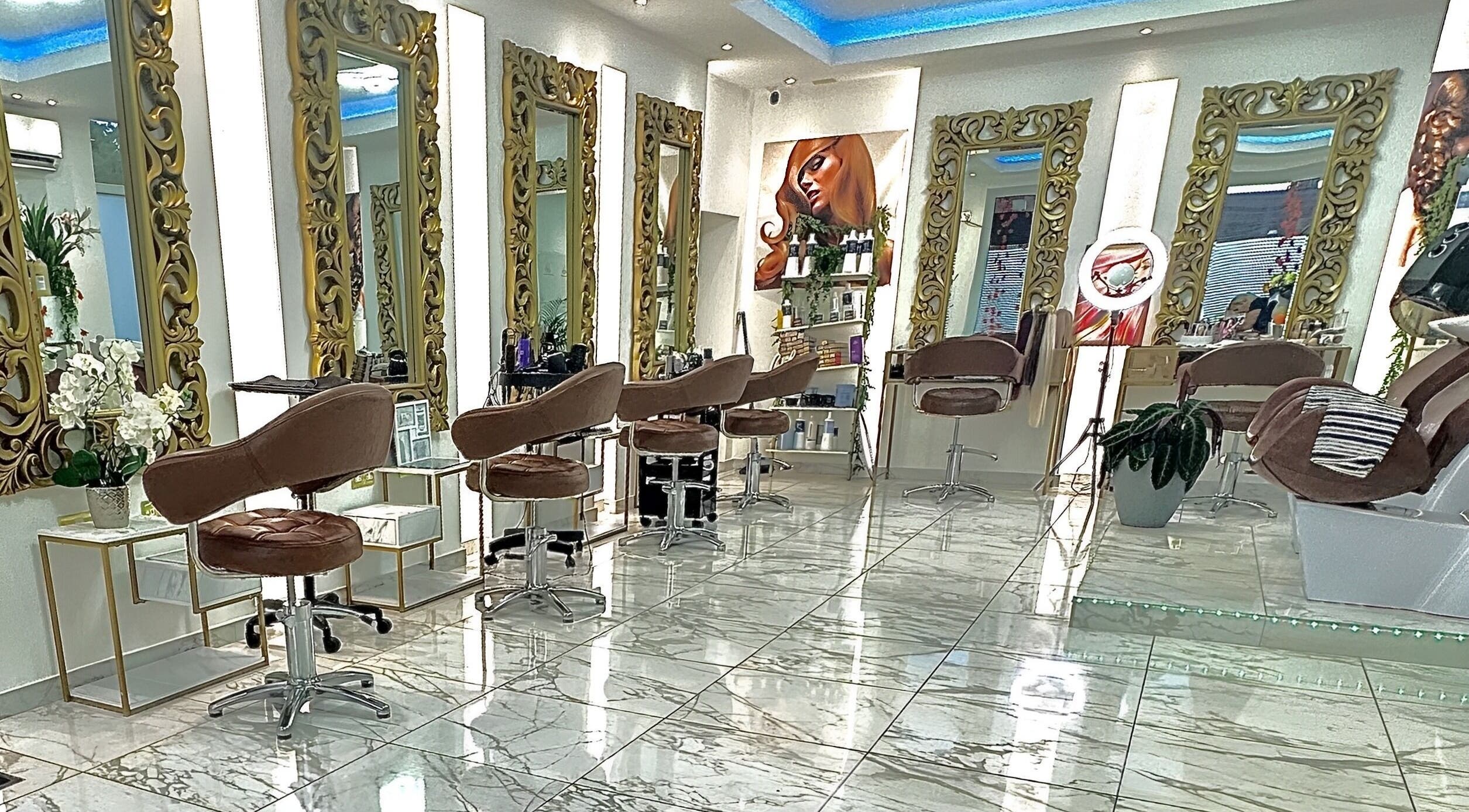 Luxurious interior of VIP Hair & Beauty Salon in Bromsgrove, England, GB with elegant mirrors and chairs.