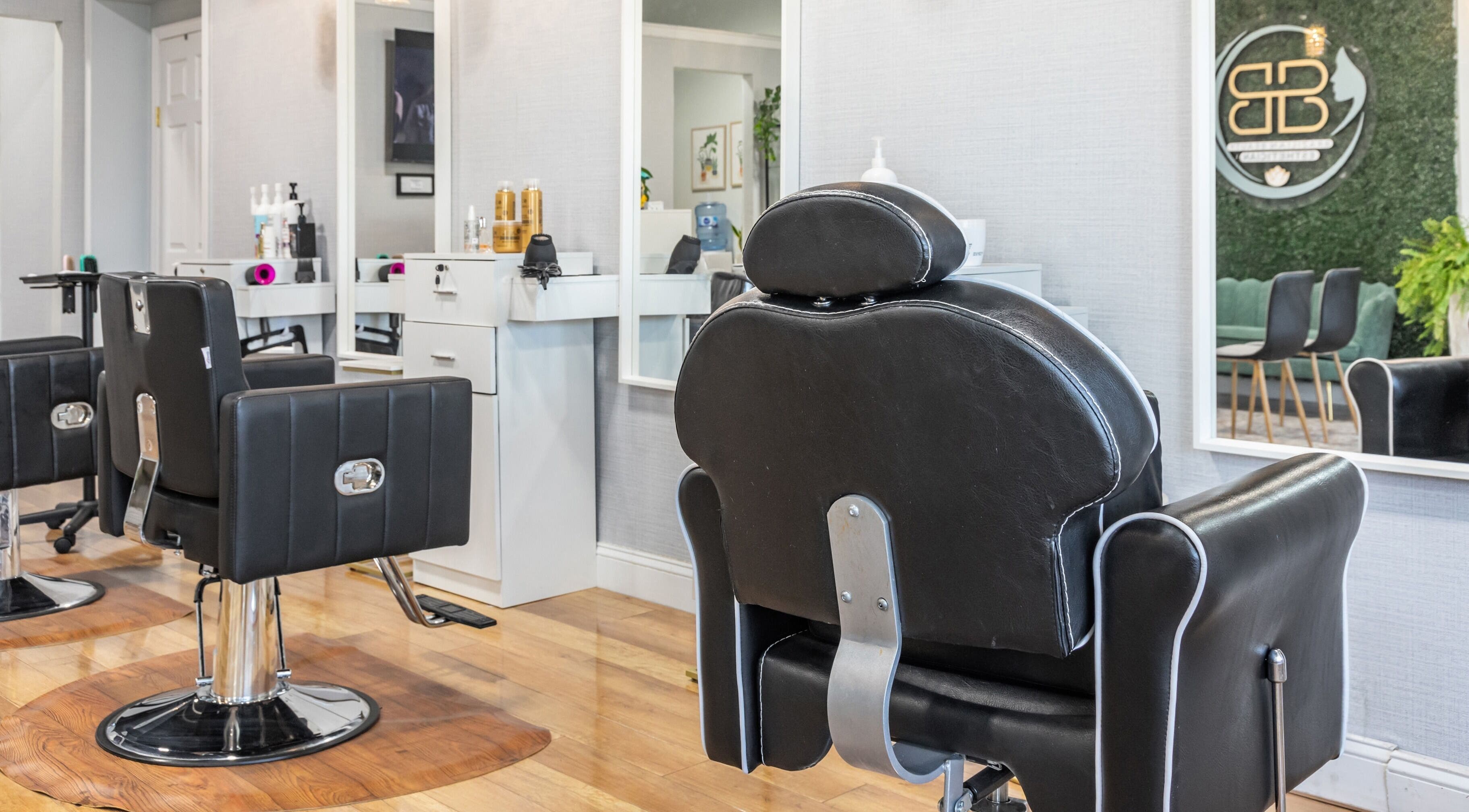 Modern salon chairs and sleek decor at Helena Alves Salon, Stoughton, Massachusetts, US.
