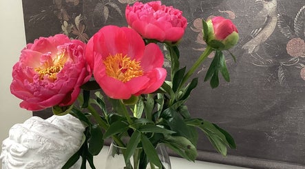 Elegant peonies in a vase at Sophia’s Beauty Room, Kinsale, County Cork, IE offer a calming ambiance.