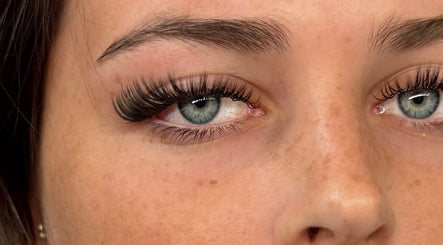 Detailed close-up of expertly applied eyelash extensions at Enhance by Han, Christchurch, GB.