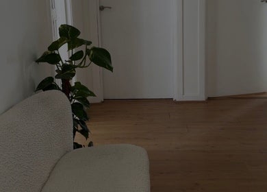 Welcoming entrance with plush seating at Enhance by Han in Christchurch, GB.