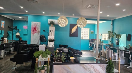 Chic interior of Highfields Hair salon in Highfields, Queensland, AU with stylish decor and plush seating.