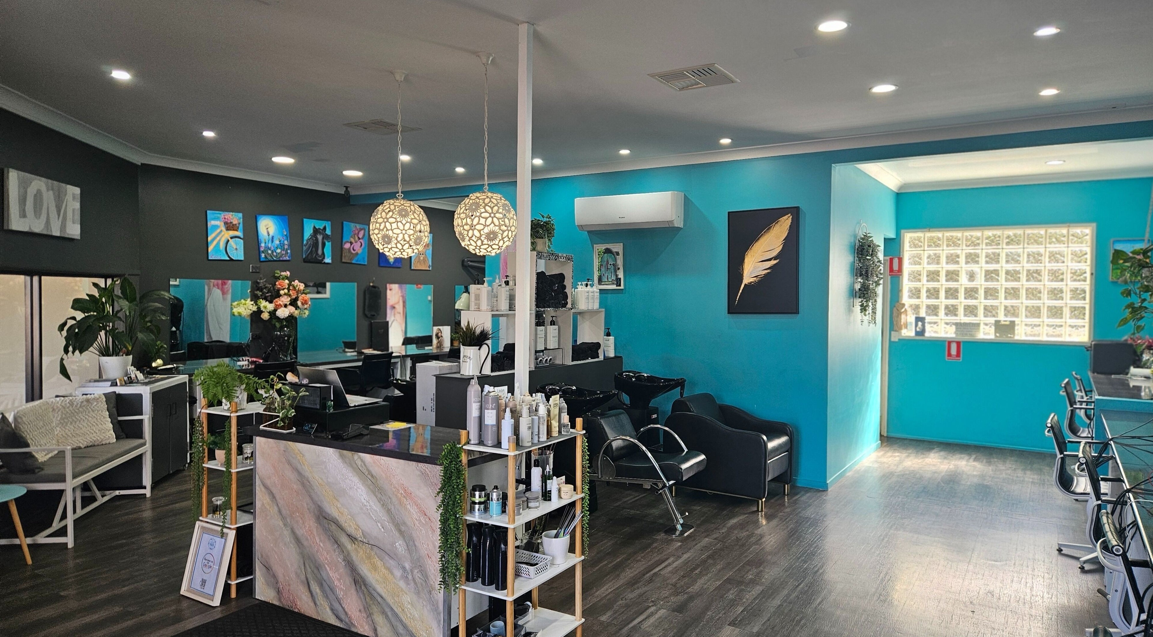 Chic interior of Highfields Hair in Highfields, Queensland, AU with stylish decor and seating.