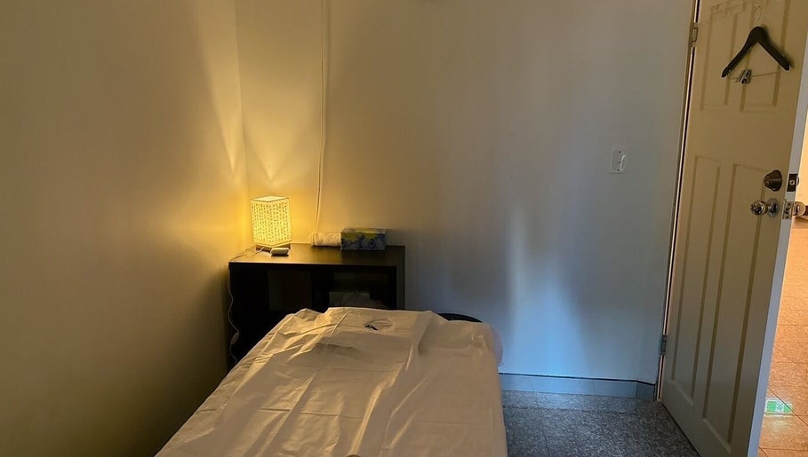 Cozy therapy room at Japanese Aromatherapy in Haymarket, New South Wales, AU with warm lighting and a massage bed.