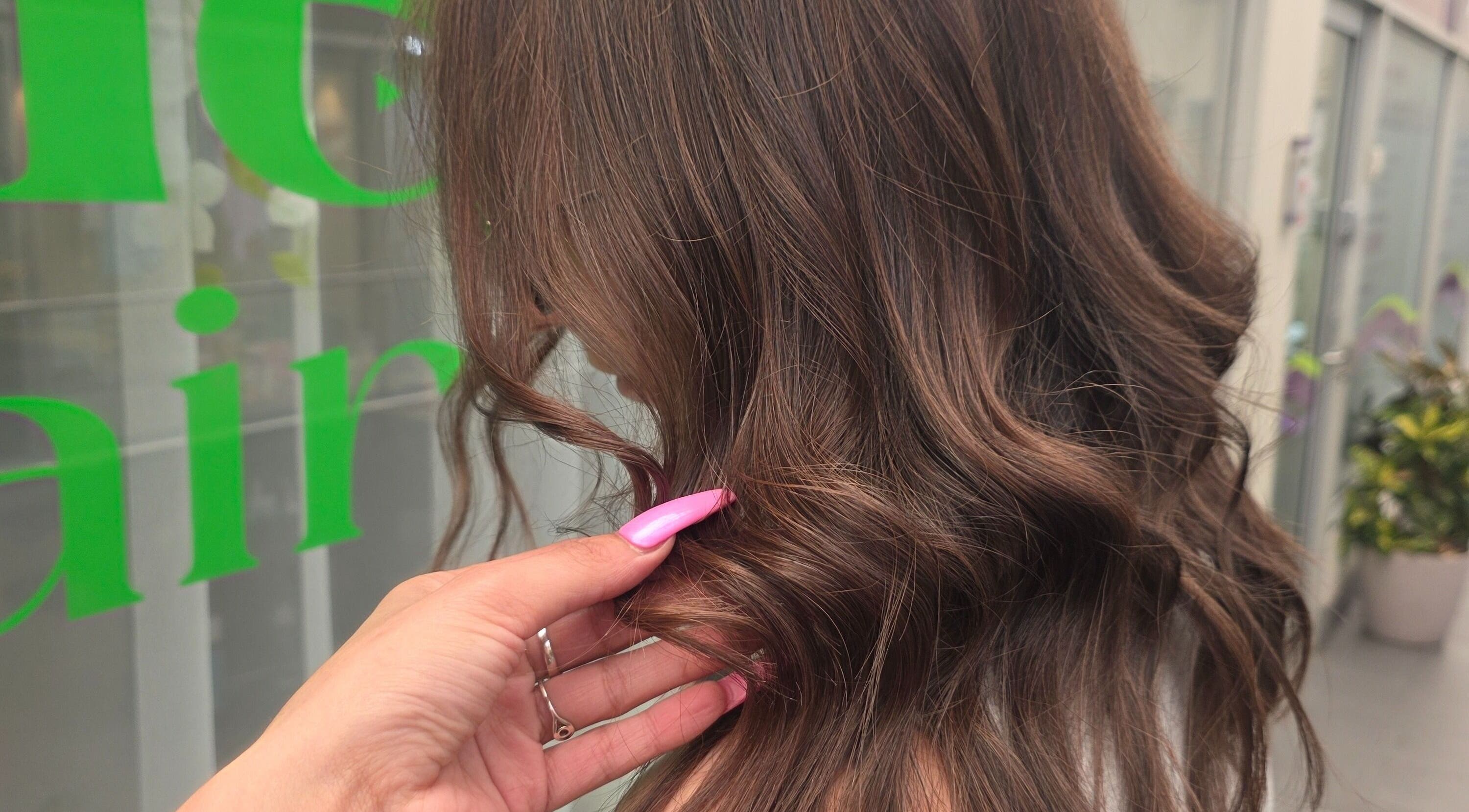 Stylish wavy hair captured at Mane Obsession, Sutherland, New South Wales, AU, showcasing professional styling.