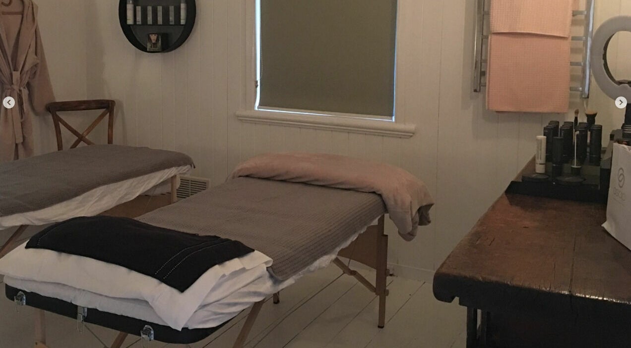 Cozy treatment room at Maleny Hair and Beauty, Maleny, Queensland, AU, with massage tables and products.