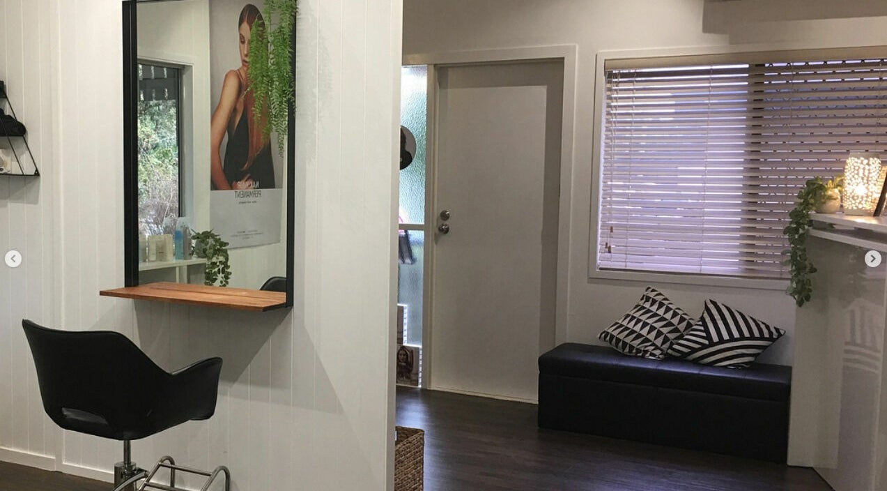 Stylish hairdresser station at Maleny Hair and Beauty, Maleny, Queensland, AU with chic decor and mirrors.