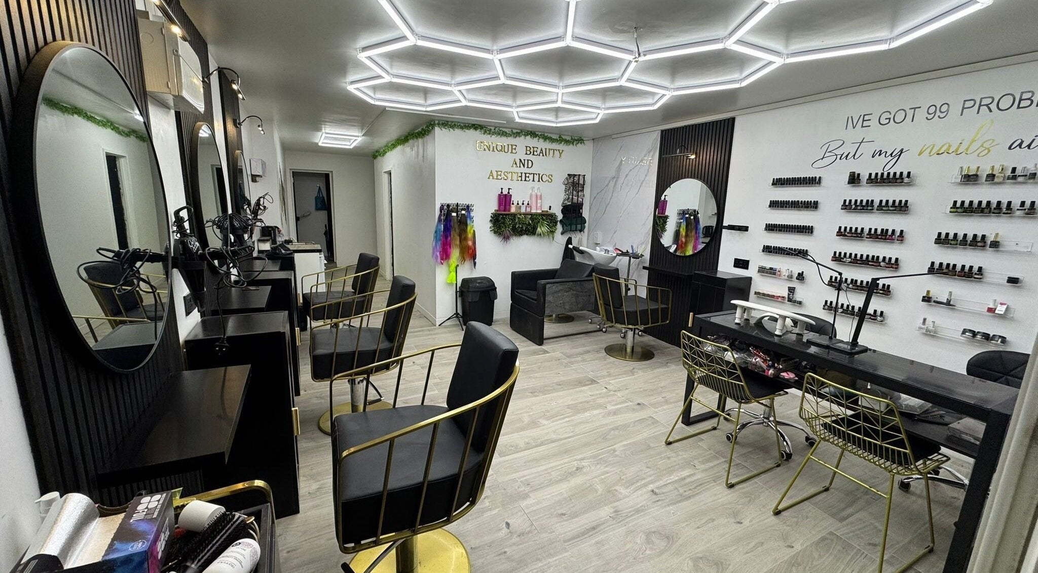 Modern salon interior of Unique Beauty and Aesthetics in Norwich, England, GB showcasing elegant seating and decor.