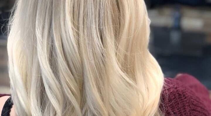 Blonde hair styled at Brian @ Twelve Stones Salon, Fresno, California, US, showcasing expert color and curl.