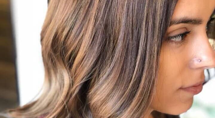 Stylish brown highlights at Brian @ Twelve Stones Salon, Fresno, California, US.