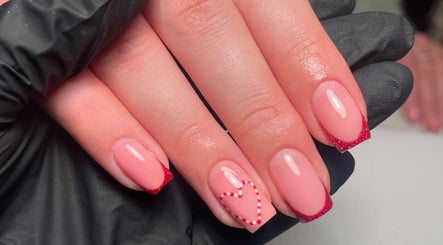 Stylish pink manicure with heart design at Glow Beauty by Karagh, Carlisle, England, GB.
