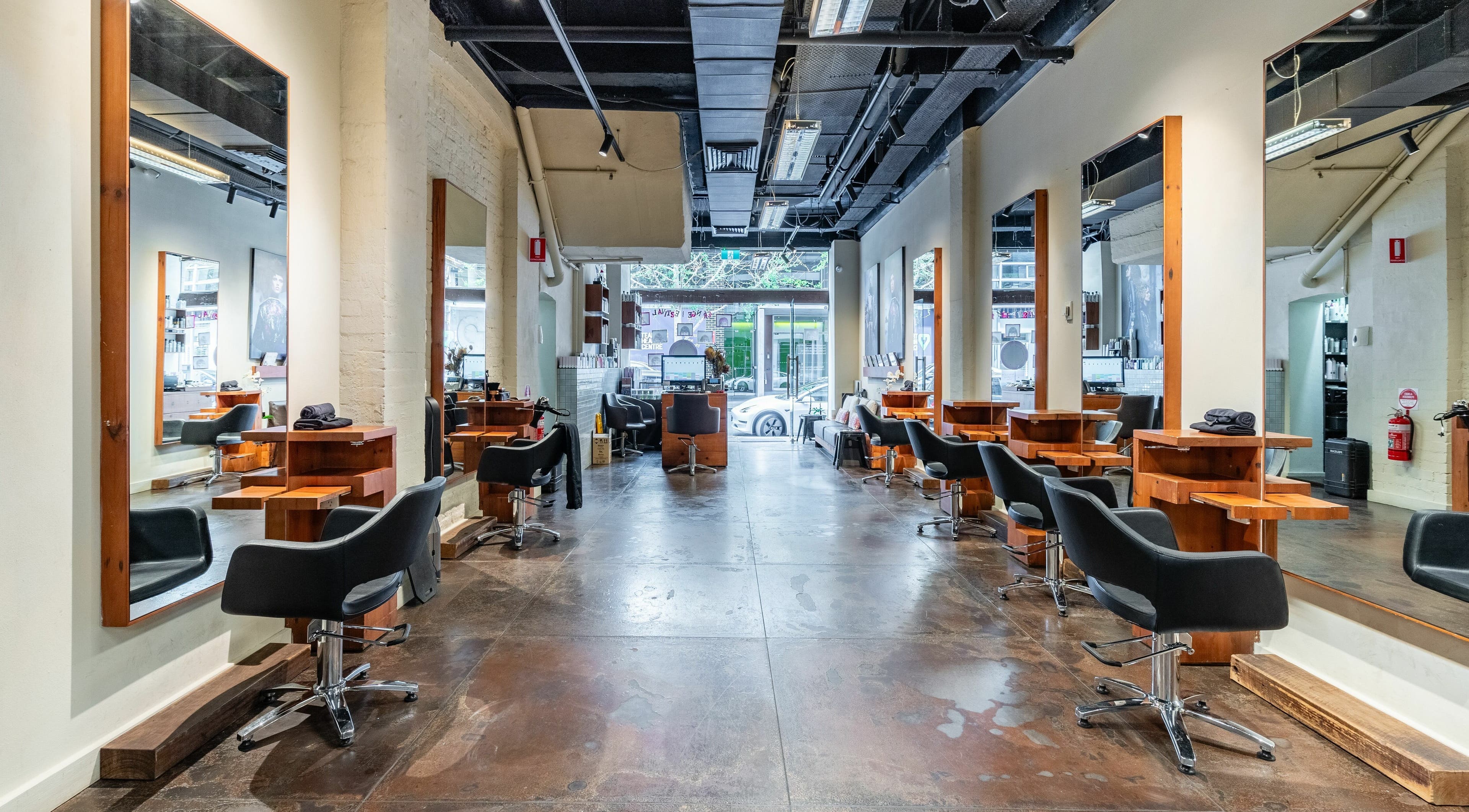 Elegant interior of Wild Life Hair SoGo in Surry Hills, New South Wales, AU with stylish styling stations.