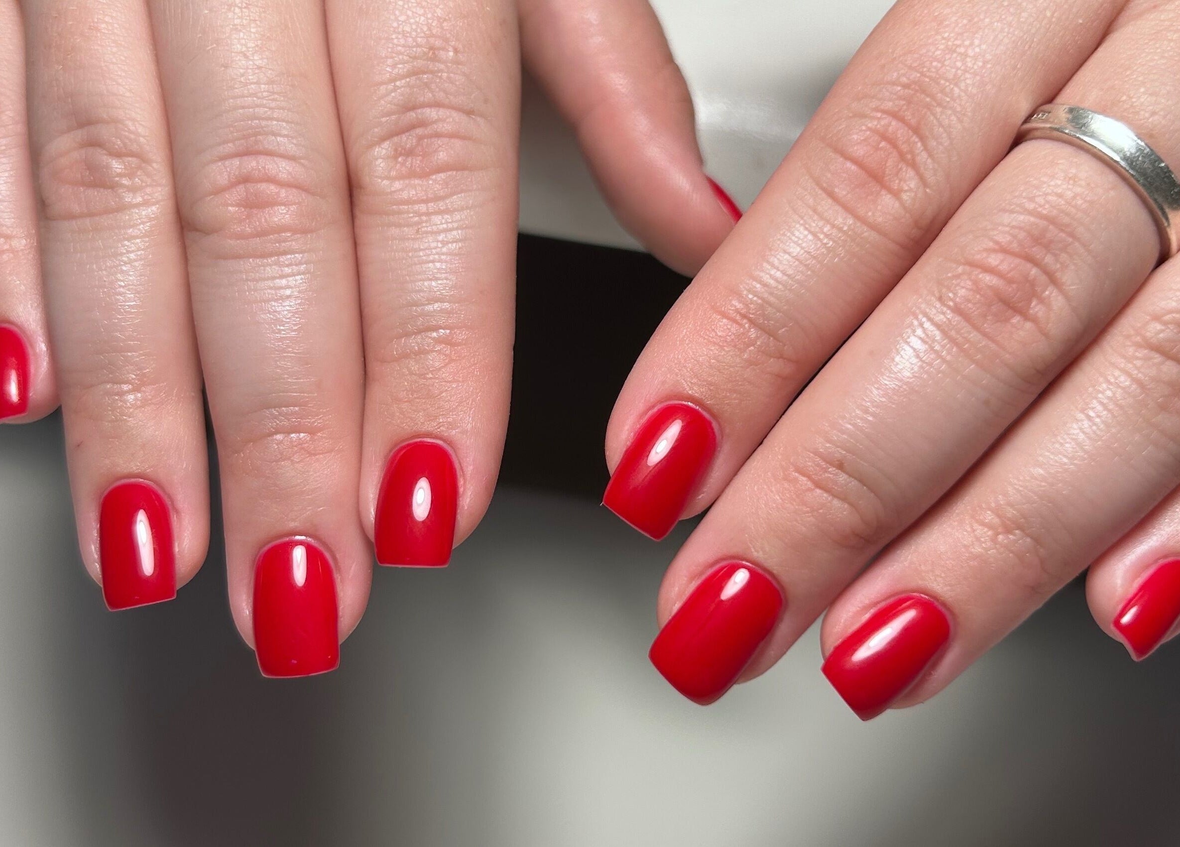 Elegant red nail manicure by MANI Studio in Victoria, Victoria, AU, showcasing expert beauty care.