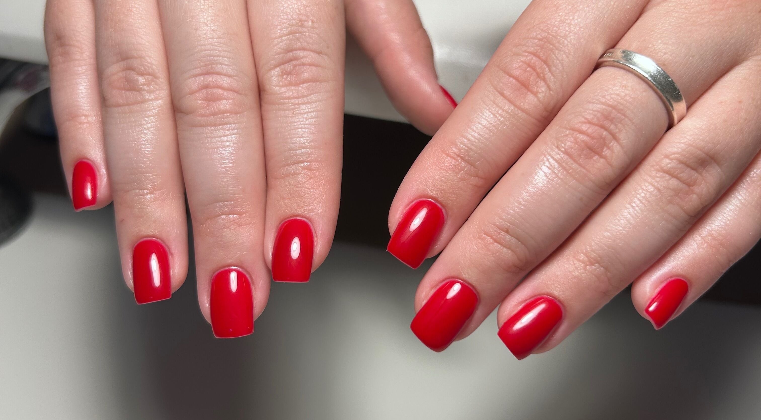Elegant red nail manicure by MANI Studio in Victoria, Victoria, AU, showcasing expert beauty care.
